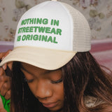 "NOTHING NEW UNDER THE SUN" TRUCKER HAT (CREAM AND WHITE)